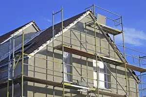 House Building Process Prints: New building with completed basic rendering of the exterior facade New building with completed basic rendering of