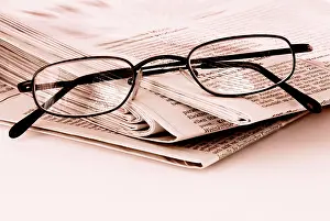 Indoor Studio Backgrounds Prints: Newspaper and pair of glasses