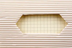 White Isolated Studio Photography Prints: Notebook and a Cut out paper with pattern on a white background