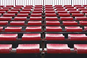 Deserted Stadium Prints: Empty and numbered seats in a stadium