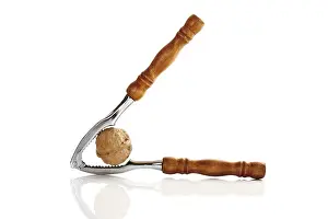 Studio Shot Of Nuts Prints: Nutcracker with walnut