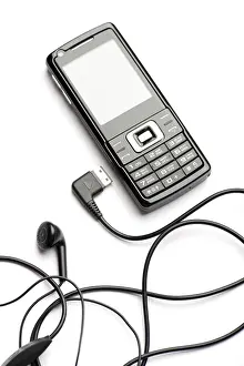 Electronic Communication Device Prints: Object on white - mobile phone with head set