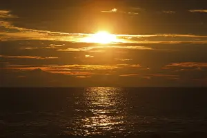 Evening Light On Water Prints: Ocean sunset with great cloudscape