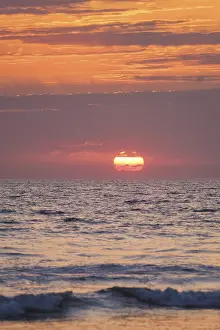 Portugal Beach Scene Prints: Ocean waves on sunset with setting sun background