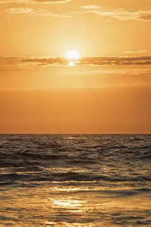 Atlantic Ocean Evening Prints: Ocean waves on sunset with setting sun background