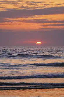 Portugal Beach Scene Prints: Ocean waves on sunset with setting sun background