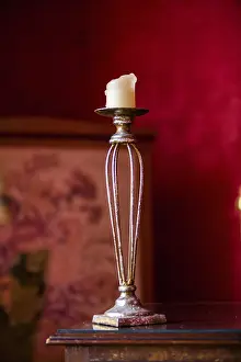 Red Background Image Prints: Old candlestick in front of red background