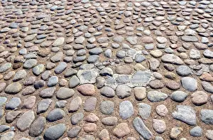 Deserted Old Town Prints: Old cobblestone pavement as creative background texture