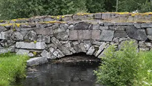 Northern Europe Waterfront Scenes Prints: Old stone bridge crosses the river Risa