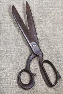 Vintage Sewing Equipment Prints: Old tailor scissors on textile background
