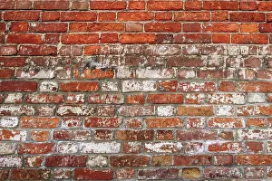 Deserted Interior Space Prints: Old wall of red and weathered bricks. Background