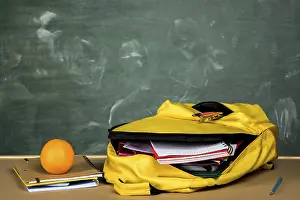Educational Institution Equipment Prints: Open backpack orange table