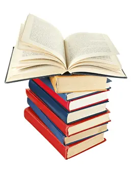 Open Book Prints: Open book on top of stack of books isolated on white background