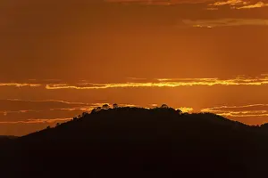 Mallorca Evening Atmosphere Prints: Orange sunset, hill in backlight