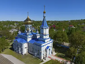 Prints of Orthodox church with blue and gold dome under clear sky, aerial view, Biserica de iarnă, iarna, Tareuka, Ţareuca, Rezina district, Republic of Moldova Moldova Prints: Orthodox Church Print, Moldova Aerial View