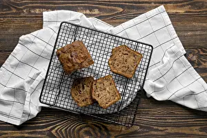 Gourmet Bakery Products Prints: Overhead view of biscuit cake with walnut on baking grid