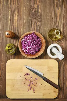 Raw Food Photography Tips Prints: Overhead view of kitchen tabletop with red cabbage and pickled cucumbers