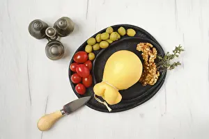 High Angle View Of Meal Prints: Overhead view of pulled scamorzza cheese on a plate