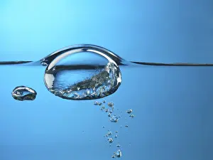 Water Surface Prints: Oxygen bubble rising to the surface of water