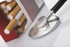 Smoking Health Risks Prints: Pack of cigarettes and a stethoscope