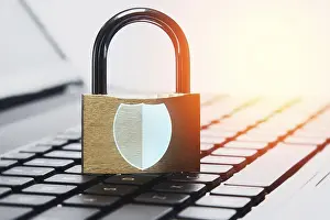 Data Protection Prints: Padlock and laptop computer with Shield symbol