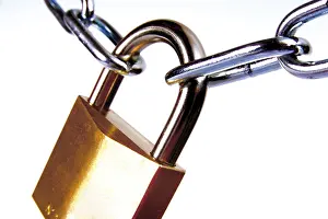 Teamwork And Collaboration Prints: Padlock locked into a chain