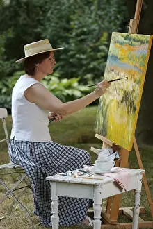 Artist At Work Prints: Painter in front of her easel