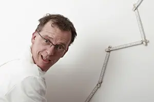 Caucasian Male Painter Prints: Painter with a yardstick