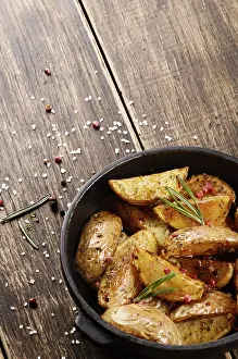 Nutrition In Baked Goods Prints: Pan Fried potatoes on baking paper rustic serving