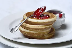 Deserted Bakery Products Prints: Pancake with raspberry jam and spoon