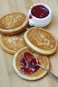 Deserted Bakery Products Prints: Pancake with raspberry jam and spoon