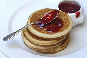 Deserted Bakery Products Prints: Pancake with raspberry jam and spoon