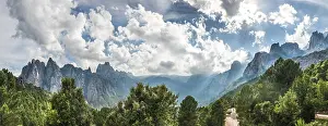 Corsica Mountain Range Prints: Panoramic, road through a valley with cliffs in clouds