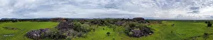 Northern Territory Scenic Views Prints: Panoramic view of green landscape and dramatic rocks under a cloudy sky