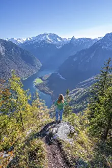 Prints of Panoramic view of the Konigssee, young hiker on the Achenkanzel, autumnal forest and snow-covered mountains, Berchtesgaden National Park, Berchtesgadener Land, Upper Bavaria, Bavaria Konigssee Prints: Panoramic Konigssee Print, Berchtesgaden National Park, Germany