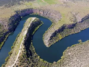 Panorama View From Above Prints: Panoramic view of a river running through dramatic gorges and dense vegetation