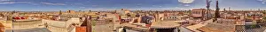 North African Buildings Prints: Panoramic view of the rooftops of Marrakech in Morocco under a blue sky with some clouds