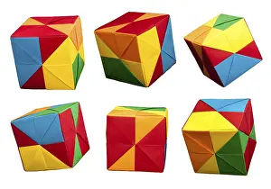 Child Development Through Art Prints: Paper made multi colored patterned cubes folded origami style