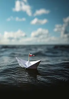 Deserted Boat Trip Prints: Paper ship in the waves