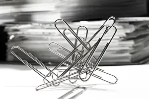 Office Supply Photography Prints: Paperclips, paper clips in front of a stack of files