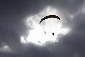 Recreational Activity In Central Europe Prints: Paraglider in the sky, thunderclouds