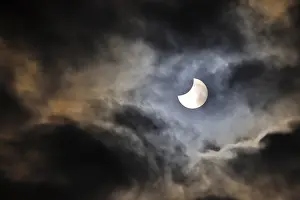Cloudy Sky Europe Prints: Partial solar eclipse, thin cloud cover