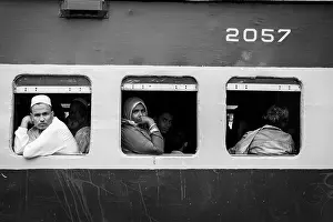 Train Window View Prints: Passengers looking out of the window of a train