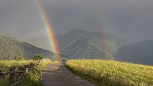 Deserted Mountain Paths Prints: A path in the Alps leads through two rainbows