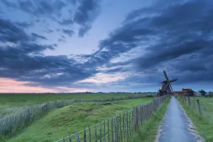 Prints of Path to windmill in clouded dusk, Groningen, Netherlands Groningen Prints: Path to Windmill Print, Groningen, Netherlands