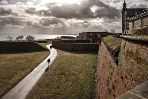 Northern Europe Landmarks Prints: Pathway through fortification under dramatic skies