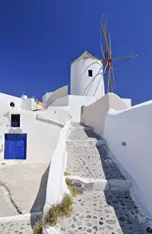Greek Island Architecture Style Prints: Paved path to a windmill in Oia
