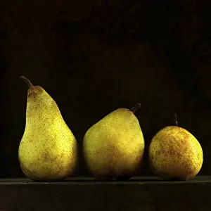 Deserted Fruit Still Life Prints: Three pears on black background