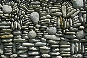 Southeast Asian Artwork Prints: Pebbles artfully piled on top of each other as a wall