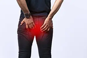 Digestive Issues Prints: People with digestive problem touching his buttock
